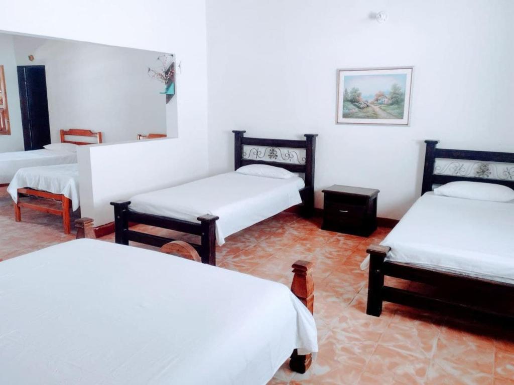 Postel nebo postele na pokoji v ubytování Hotel Refugio Bike