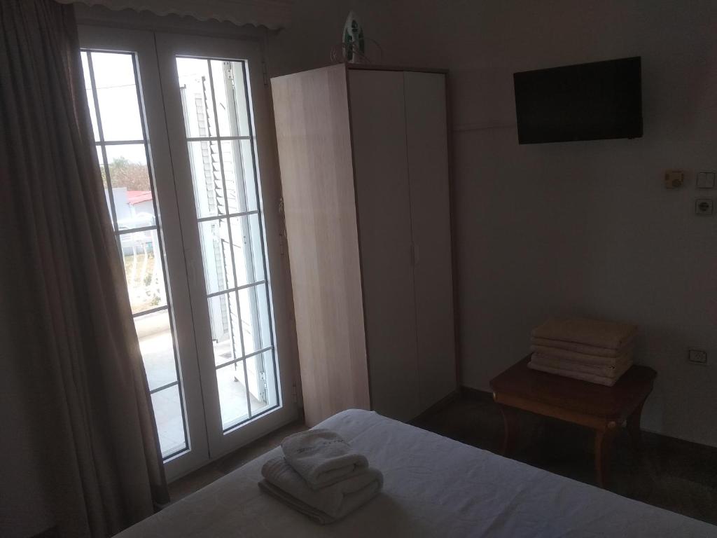 Łóżko lub łóżka w pokoju w obiekcie Villa Blue Apartments