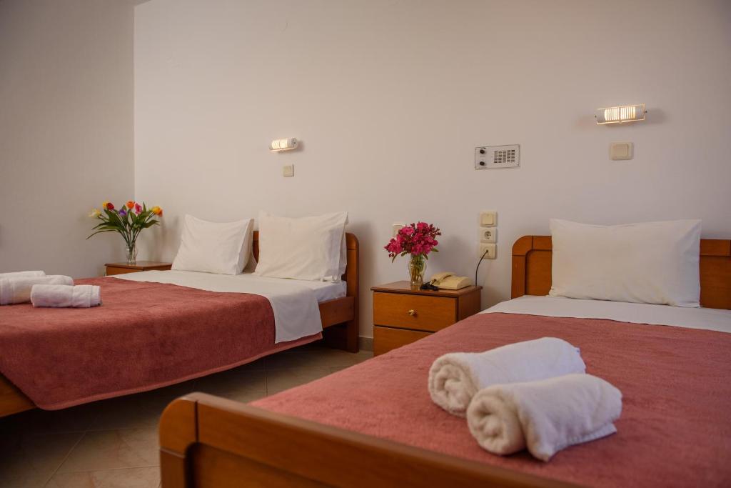 Postel nebo postele na pokoji v ubytování Melissa Hotel