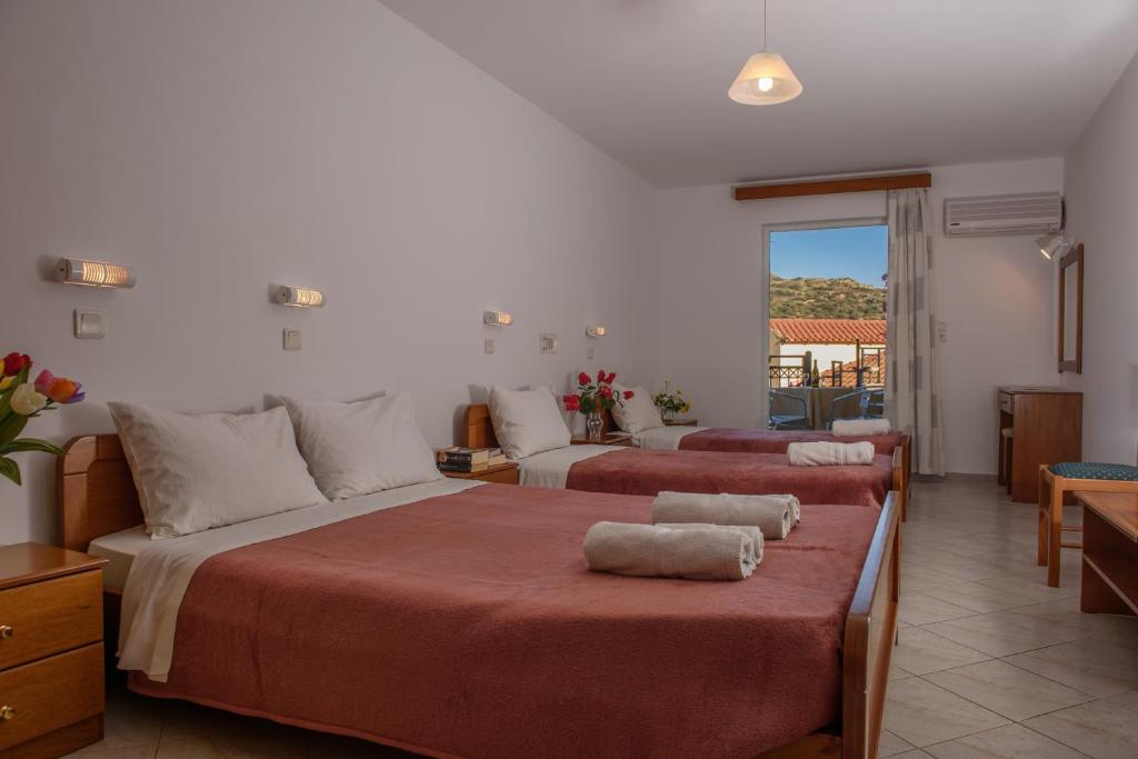 Postel nebo postele na pokoji v ubytování Melissa Hotel