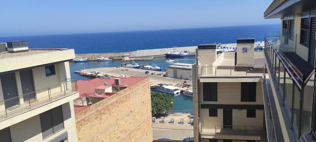 a view of a harbor with boats in the water at Apartamento Numi II in L'Ametlla de Mar