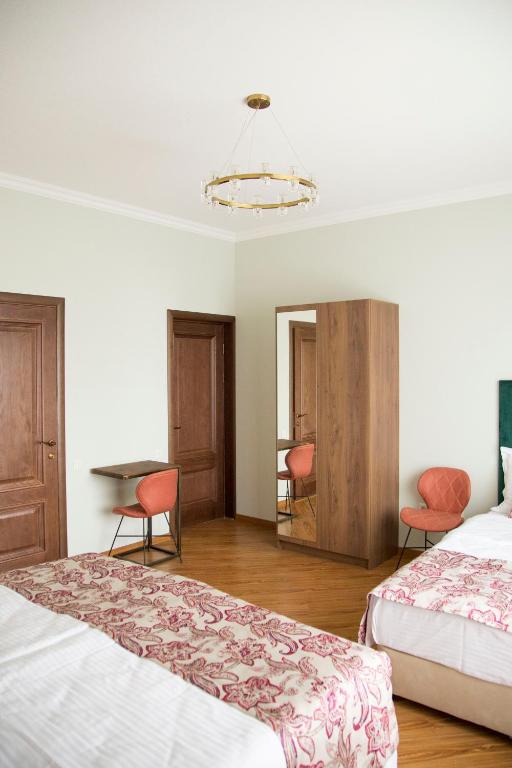 Postel nebo postele na pokoji v ubytování Phazisi Hotel