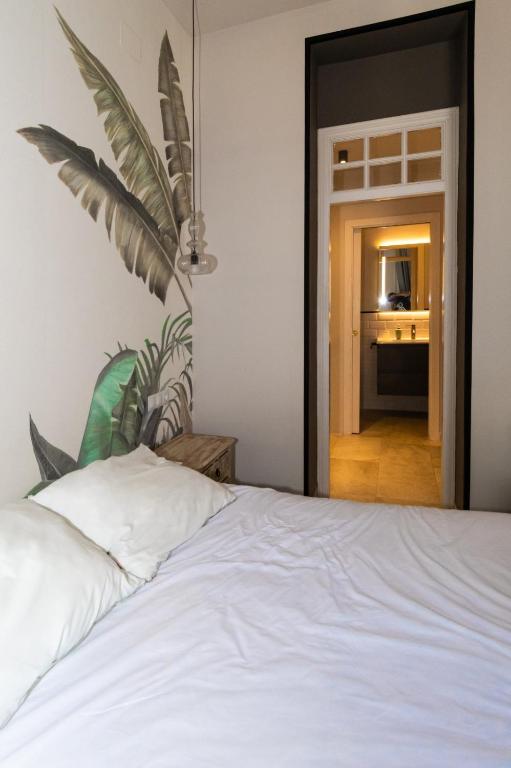 Postel nebo postele na pokoji v ubytování Triana Pelay Suites