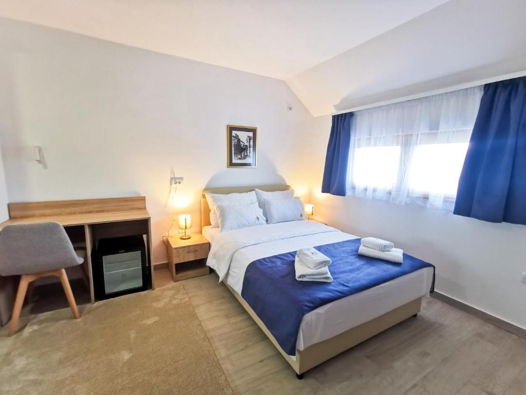 Krevet ili kreveti u jedinici u okviru objekta Hotel Agape