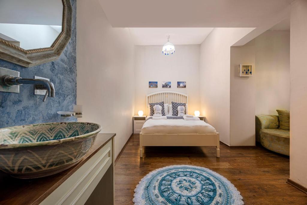 Postel nebo postele na pokoji v ubytování Zimmer & Spa Kesem Hamaga