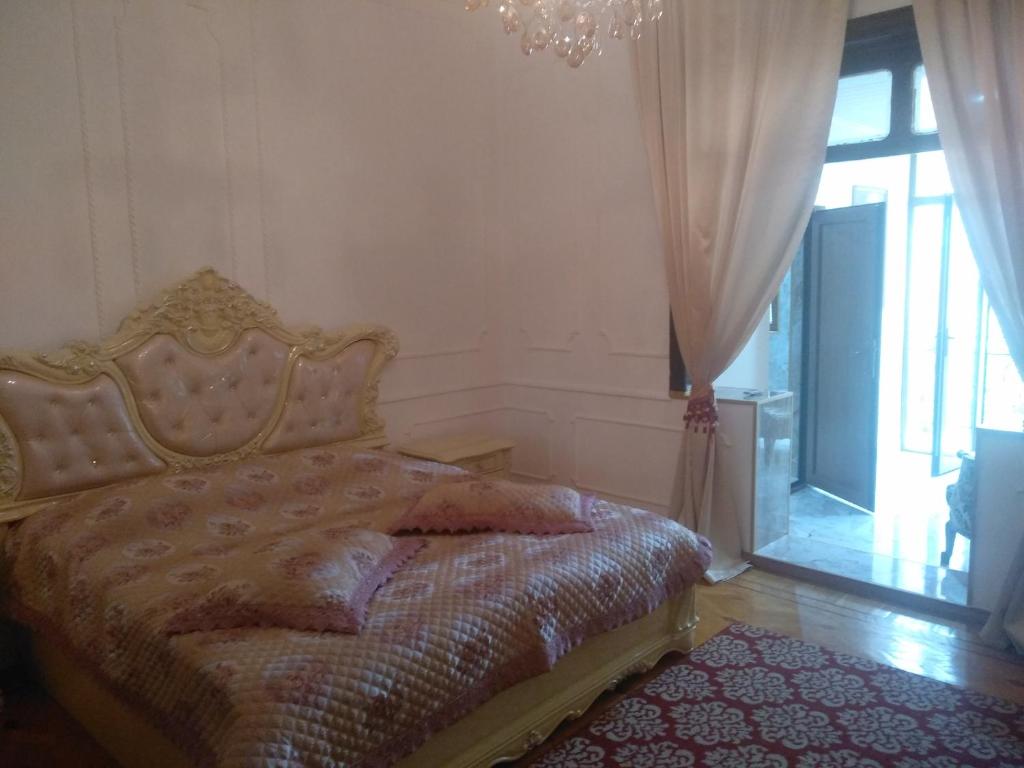 Postel nebo postele na pokoji v ubytování Hotel Royal