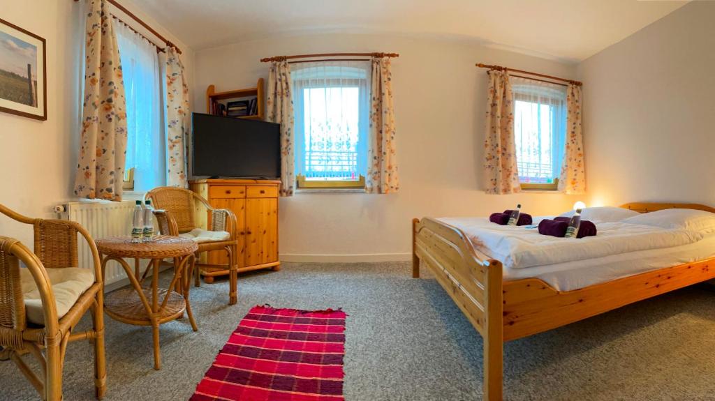 Postel nebo postele na pokoji v ubytování Einkehr zur Rennstrecke