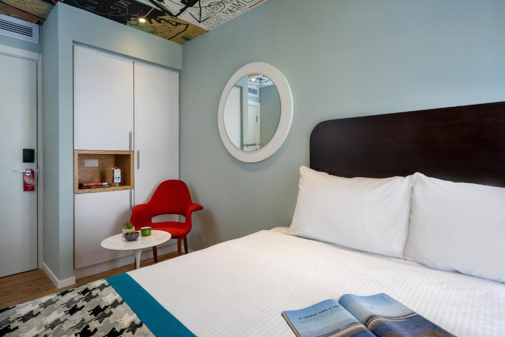 Voodi või voodid majutusasutuse Hotel 75 by Prima Hotels toas