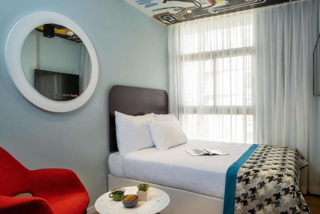 Voodi või voodid majutusasutuse Hotel 75 by Prima Hotels toas