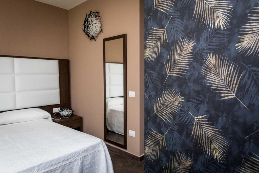 Postel nebo postele na pokoji v ubytování 4essences Boutique Rooms