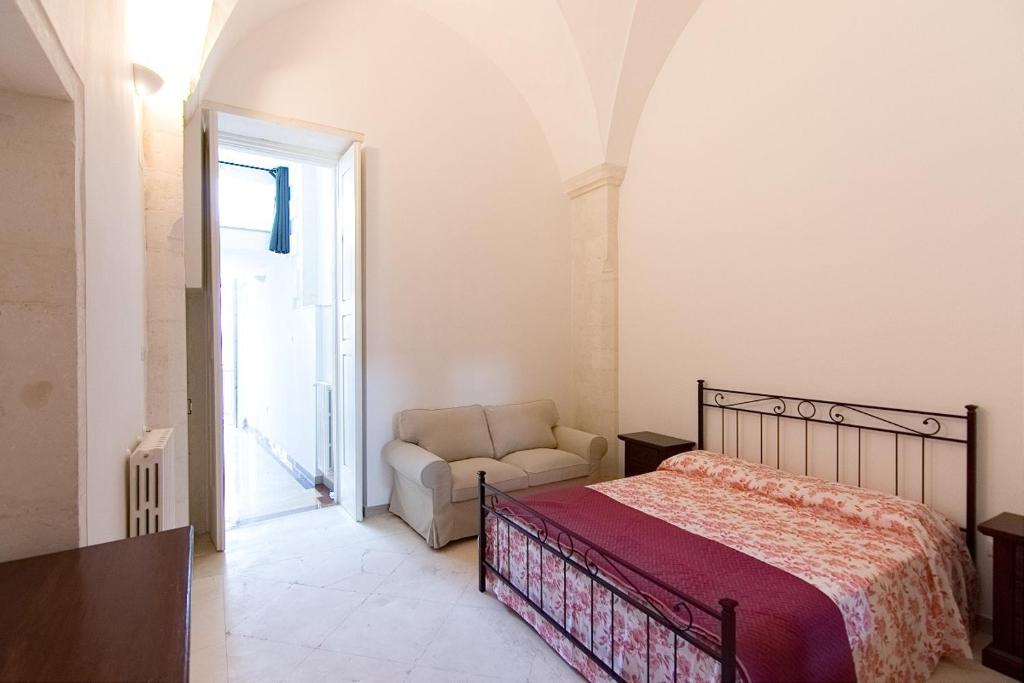 A bed or beds in a room at Appartamento Palazzo Ancona
