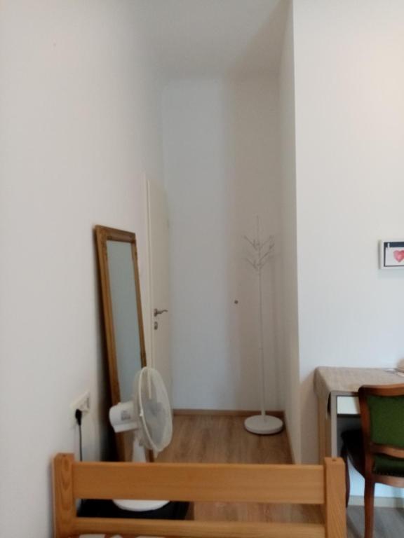 a bathroom with a toilet and a mirror in a room at San Eleuterio Guesthouse in Poreč