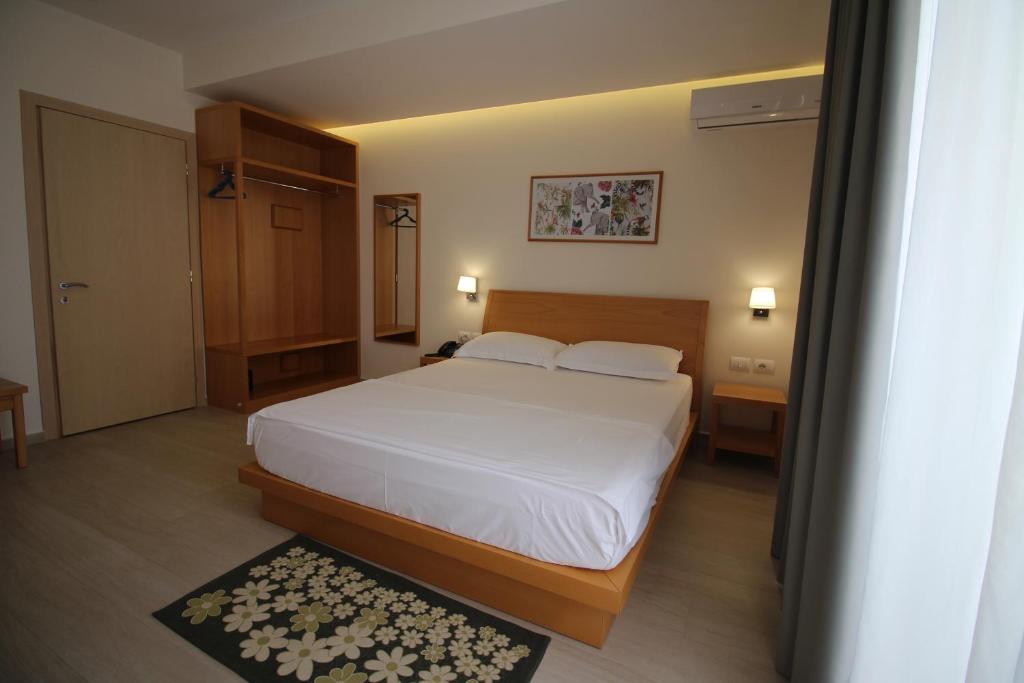 Postel nebo postele na pokoji v ubytování Hotel Ari 2
