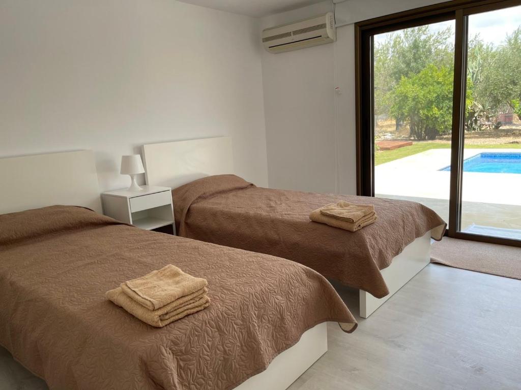 Postel nebo postele na pokoji v ubytování Villa Athasia