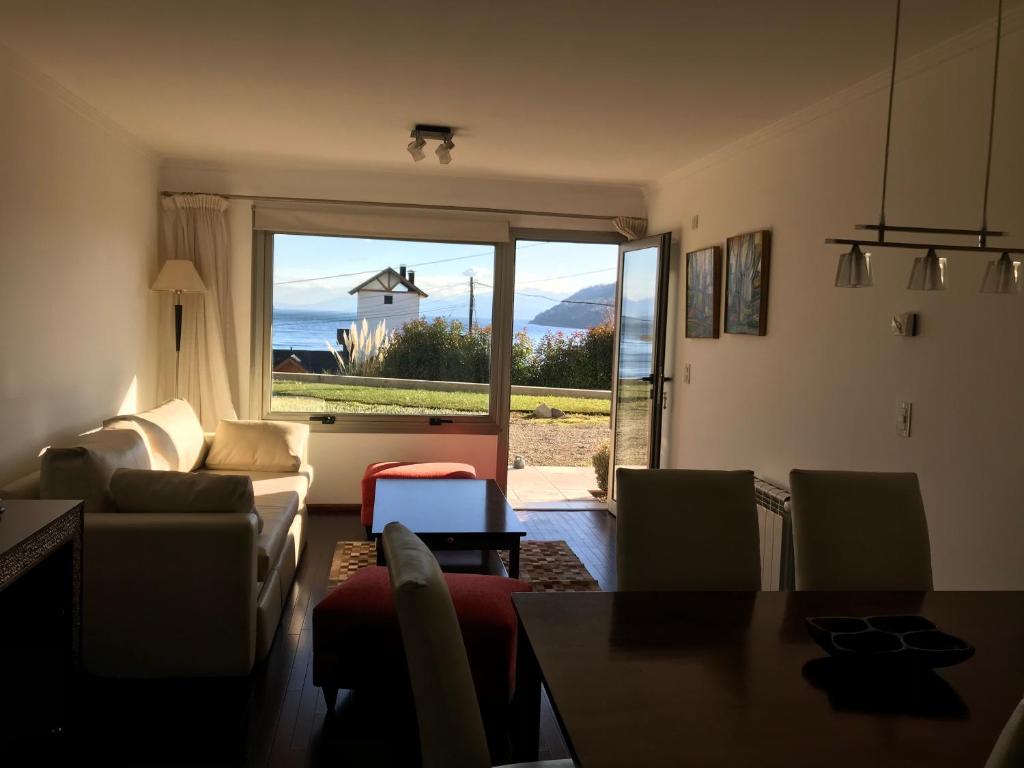 a living room with a view of the ocean at Quintaluna in San Carlos de Bariloche