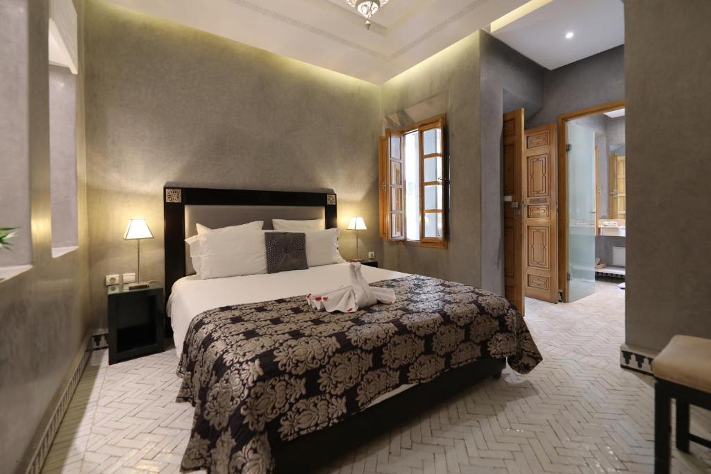 Postel nebo postele na pokoji v ubytování Riad L'Etoile D'Orient
