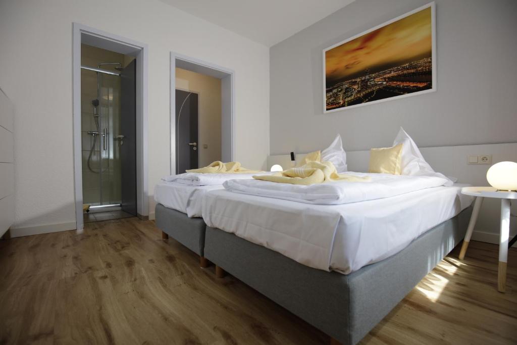 Ένα ή περισσότερα κρεβάτια σε δωμάτιο στο Hotel Beck