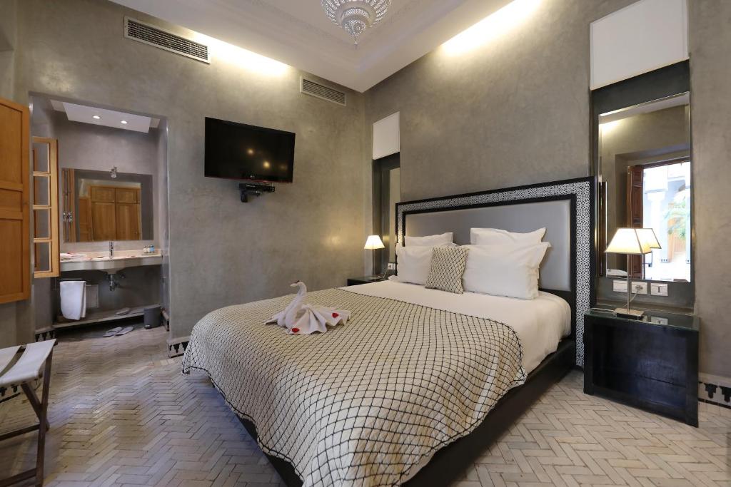 Postel nebo postele na pokoji v ubytování Riad L'Etoile D'Orient