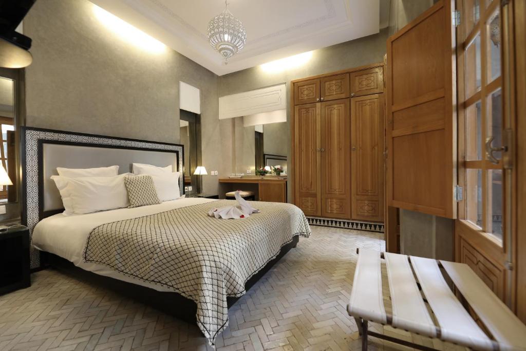 Postel nebo postele na pokoji v ubytování Riad L'Etoile D'Orient