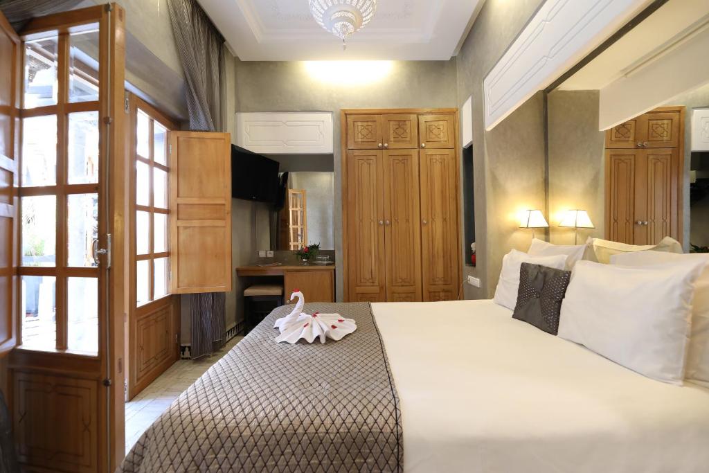 Postel nebo postele na pokoji v ubytování Riad L'Etoile D'Orient