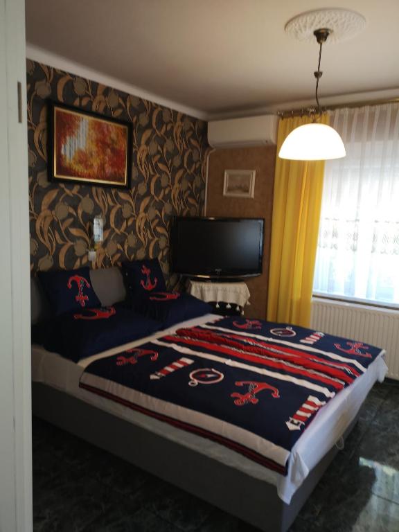Posteľ alebo postele v izbe v ubytovaní Lake Balaton Apartmanház