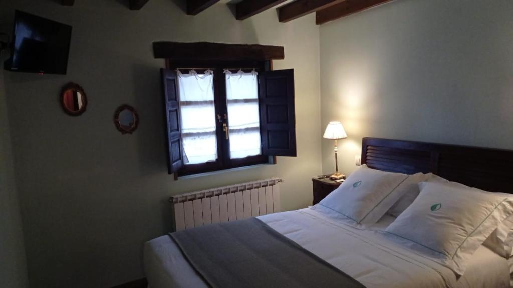 A bed or beds in a room at Posada Reserva Verde