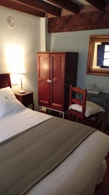 A bed or beds in a room at Posada Reserva Verde