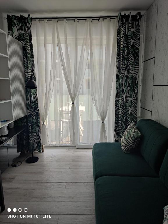 Posedenie v ubytovaní Apartament Tęcza
