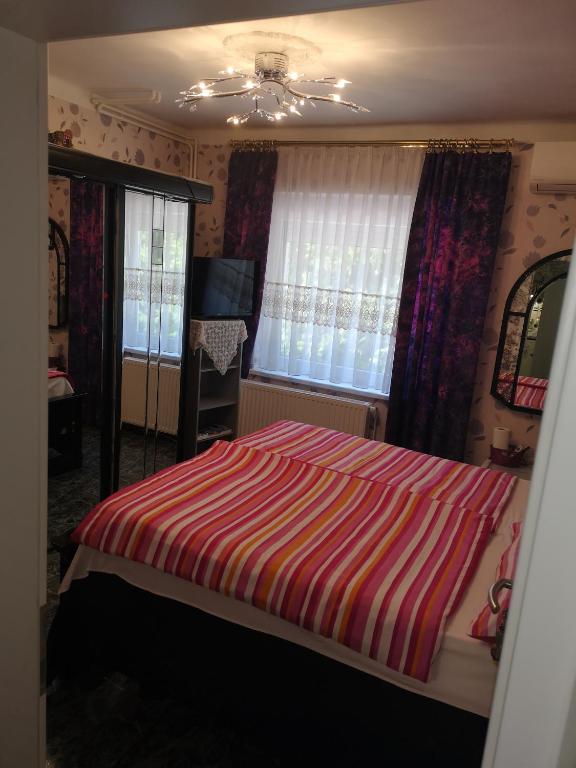 Posteľ alebo postele v izbe v ubytovaní Lake Balaton Apartmanház