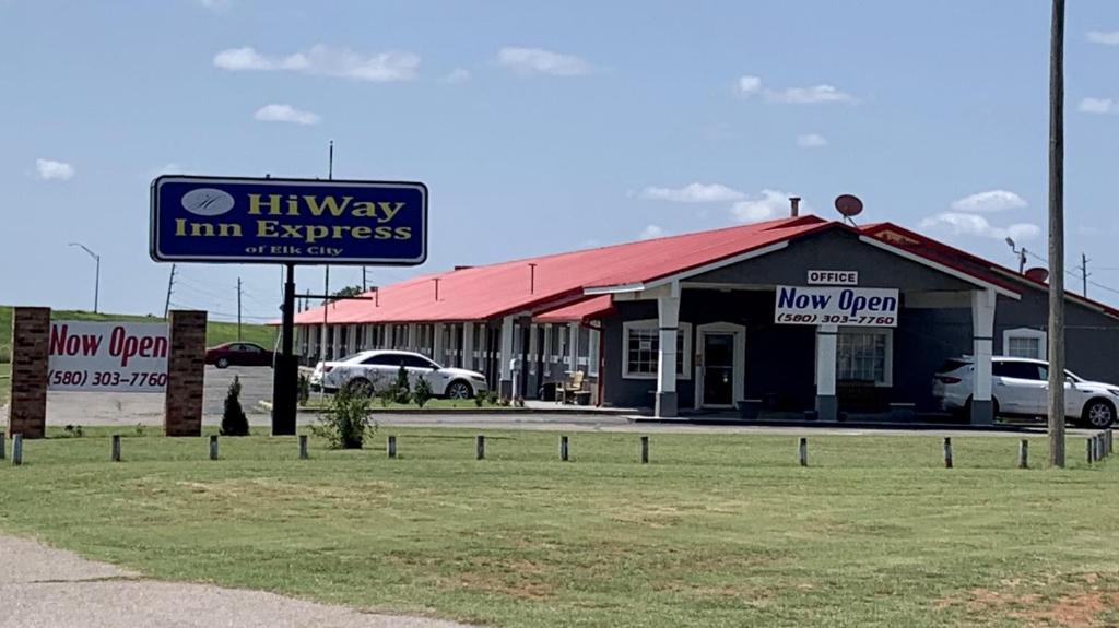 a hilway inn express sign in front of a building at HiWay Inn Express in Elk City
