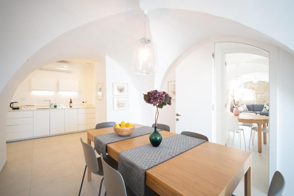 a kitchen and dining room with a table and chairs at חקל תפוחין in Safed