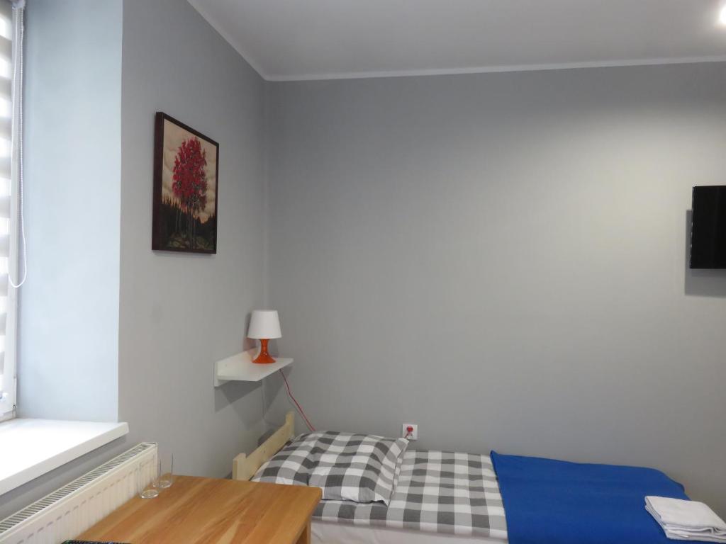 Postel nebo postele na pokoji v ubytování Hostel Karpacki Szymon Szczepan