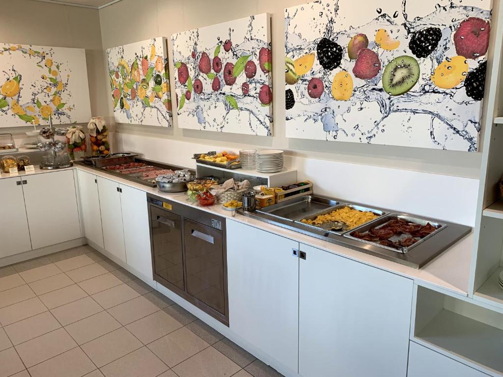 Kuchyň nebo kuchyňský kout v ubytování Hotel Miramare
