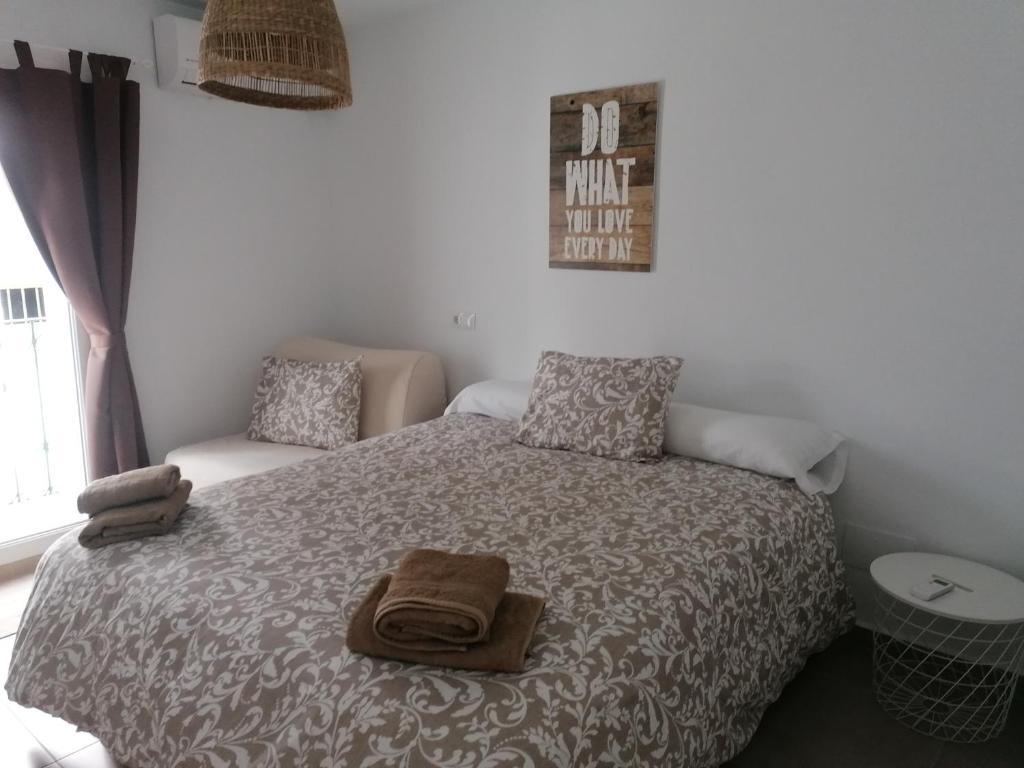 En eller flere senge i et værelse på Casa Marlu