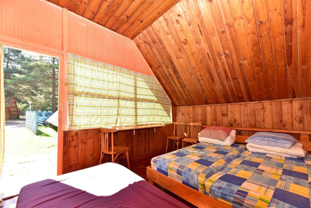Postel nebo postele na pokoji v ubytování Camping Vaivari Jūrmala