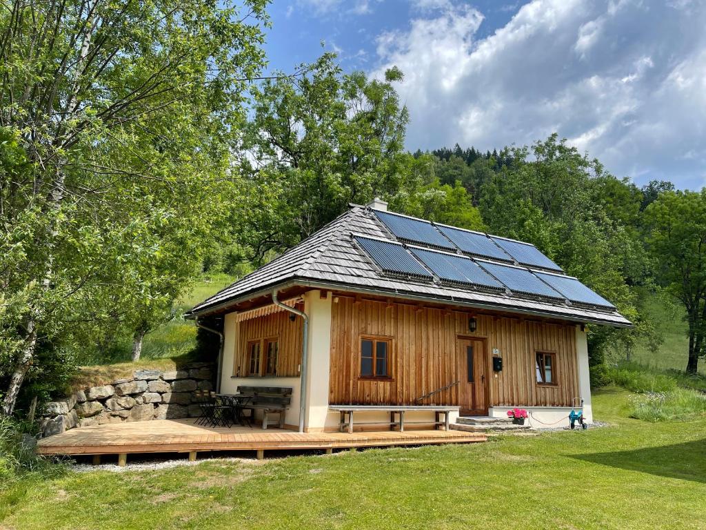 a house with solar panels on the roof at Klösterle Haus Egon in Arriach