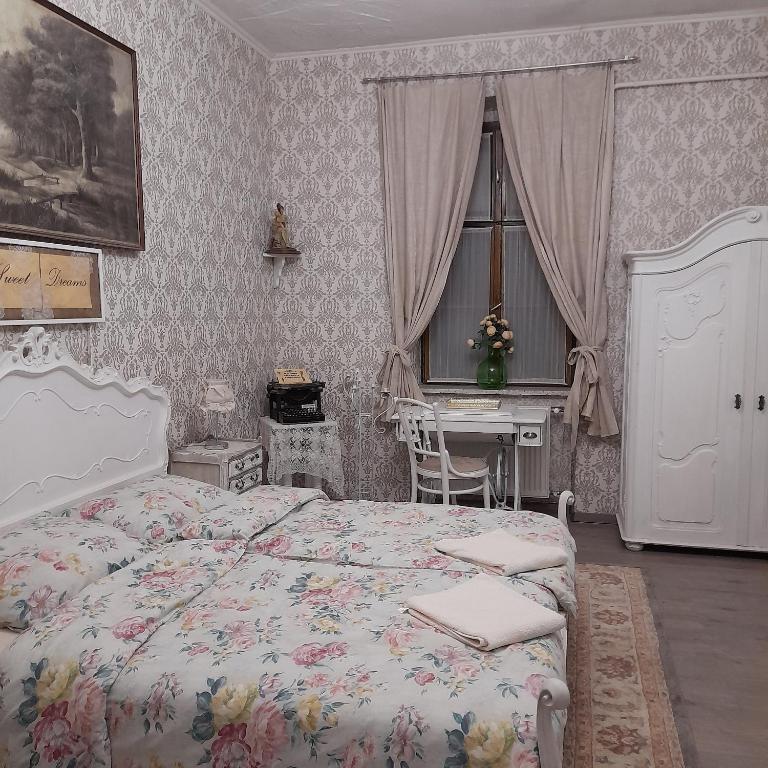 Postel nebo postele na pokoji v ubytování Locomotiv Vendégház