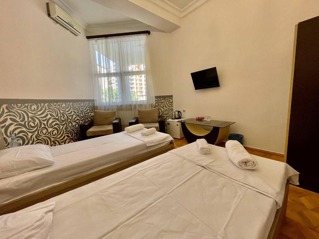 Postel nebo postele na pokoji v ubytování Olive hotel