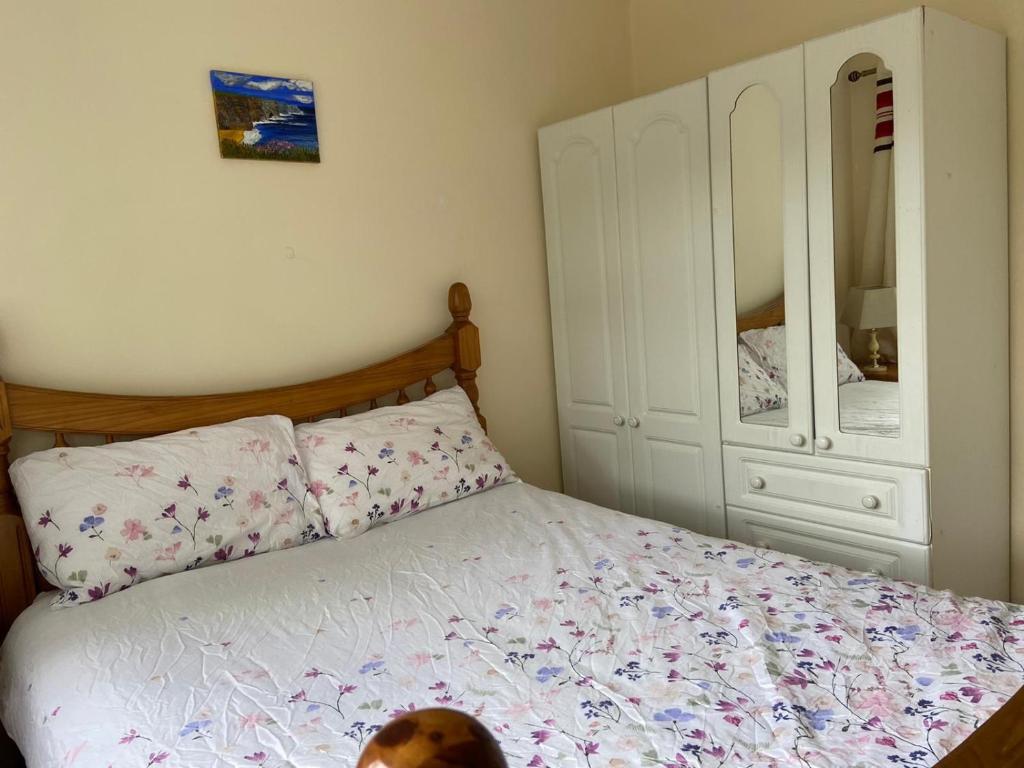 Postel nebo postele na pokoji v ubytování Beechwood Lodge