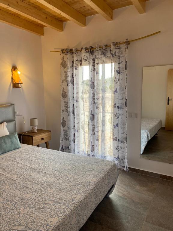 Postel nebo postele na pokoji v ubytování Quinta das Aguas