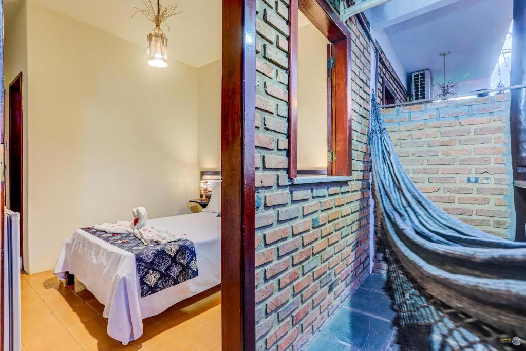 Cama ou camas em um quarto em Pousada Galeão Itacaré