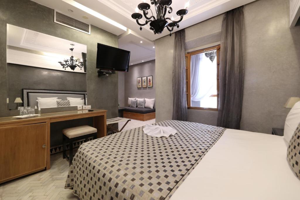 Postel nebo postele na pokoji v ubytování Riad L'Etoile D'Orient