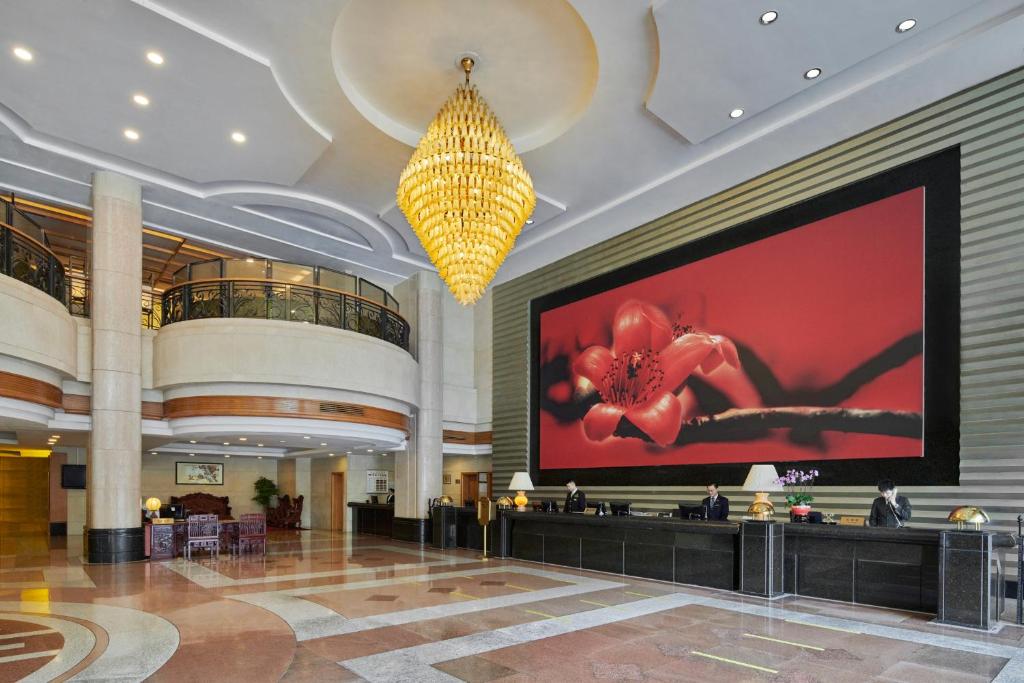 a large screen in the lobby of a hotel at Hotel Canton in Guangzhou