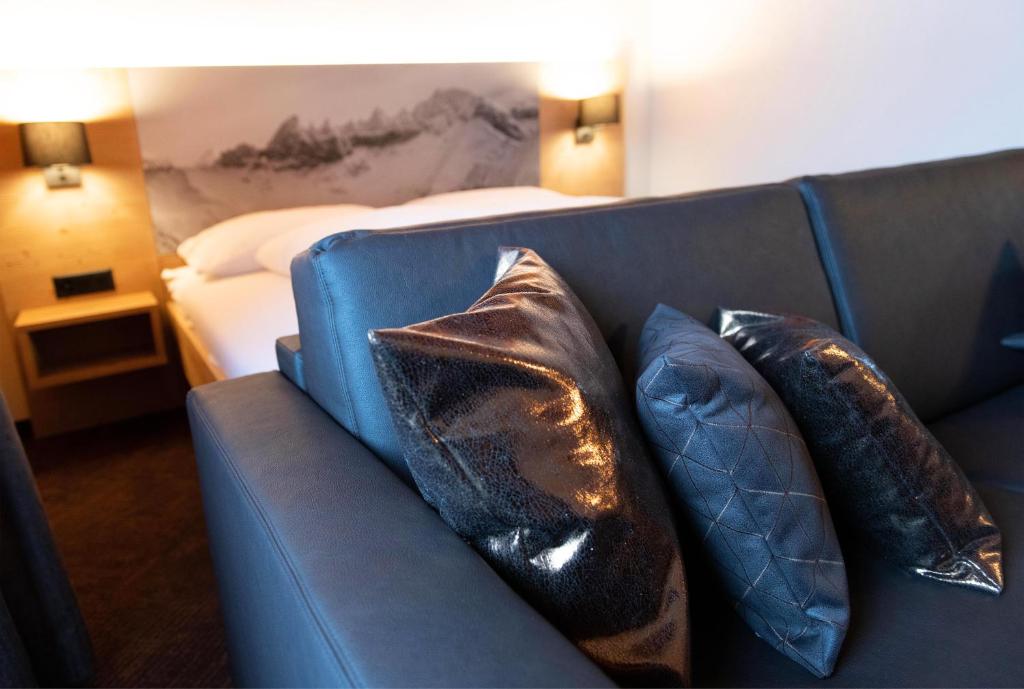 Postel nebo postele na pokoji v ubytování Hotel Bergführer