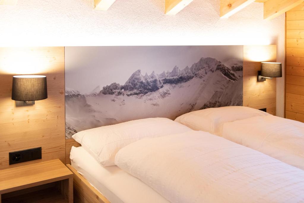 Postel nebo postele na pokoji v ubytování Hotel Bergführer