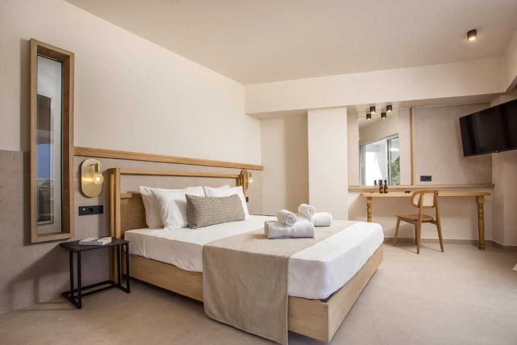 Postel nebo postele na pokoji v ubytování Ladiko Suites - Faliraki