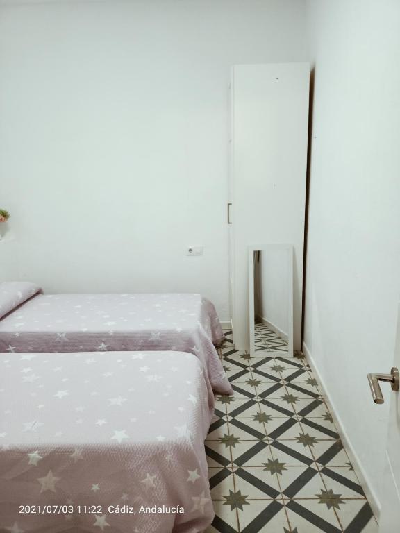 Postel nebo postele na pokoji v ubytování Apartamento Ara