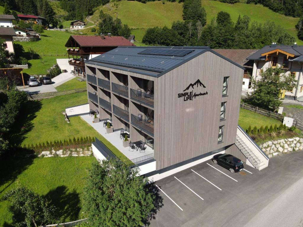 an overhead view of a large building with a parking lot at Simple Life Apartments in Rauris