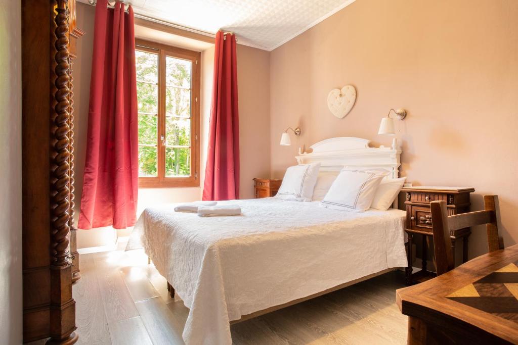 Postel nebo postele na pokoji v ubytování Chambre d'Hôtes Au Jardin Des Saveurs