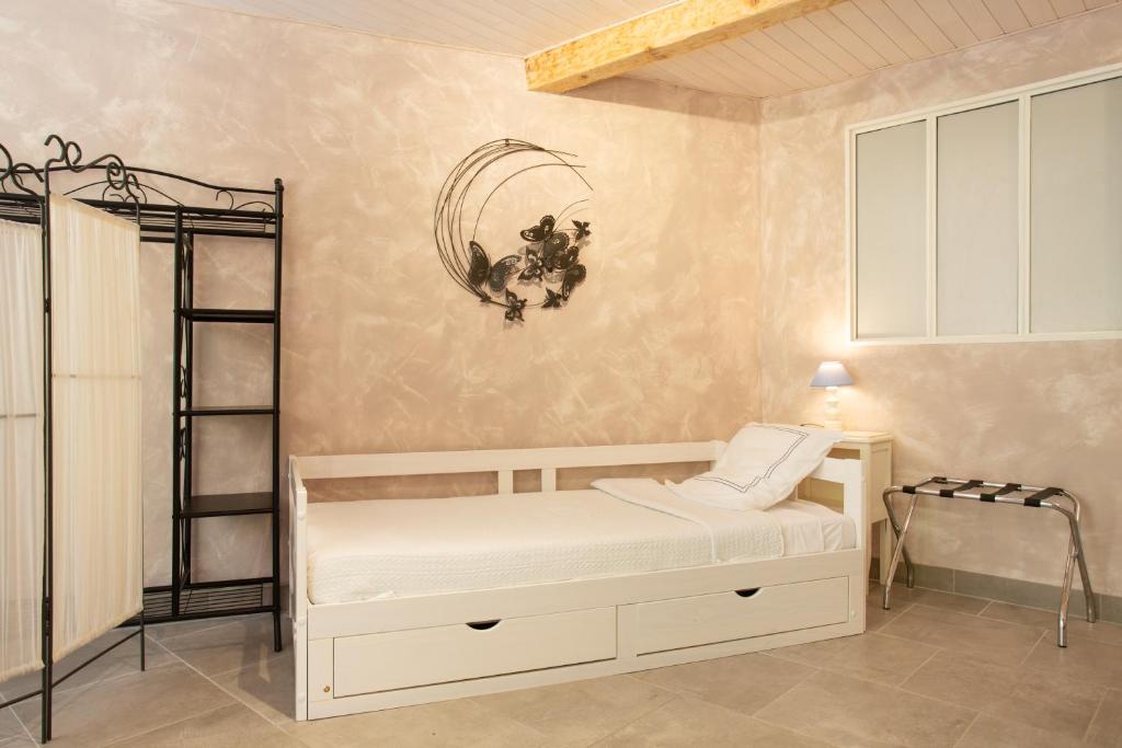 Postel nebo postele na pokoji v ubytování Chambre d'Hôtes Au Jardin Des Saveurs